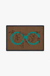 Monkey See Monkey Do Turquoise Doormat by Iris Apfel