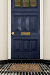 Spring Has Sprung Burnt Orange Doormat by Iris Apfel